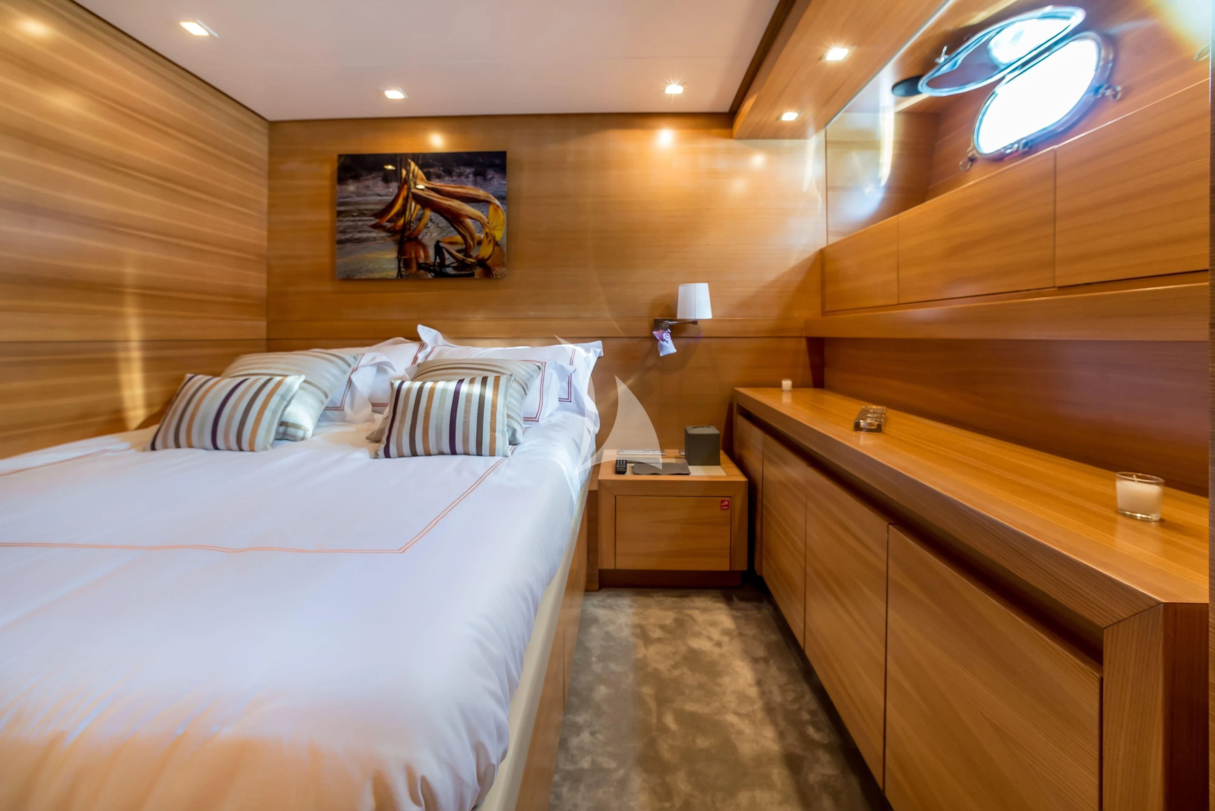 a room with a bed and a desk aboard PERTULA Yacht for Sale