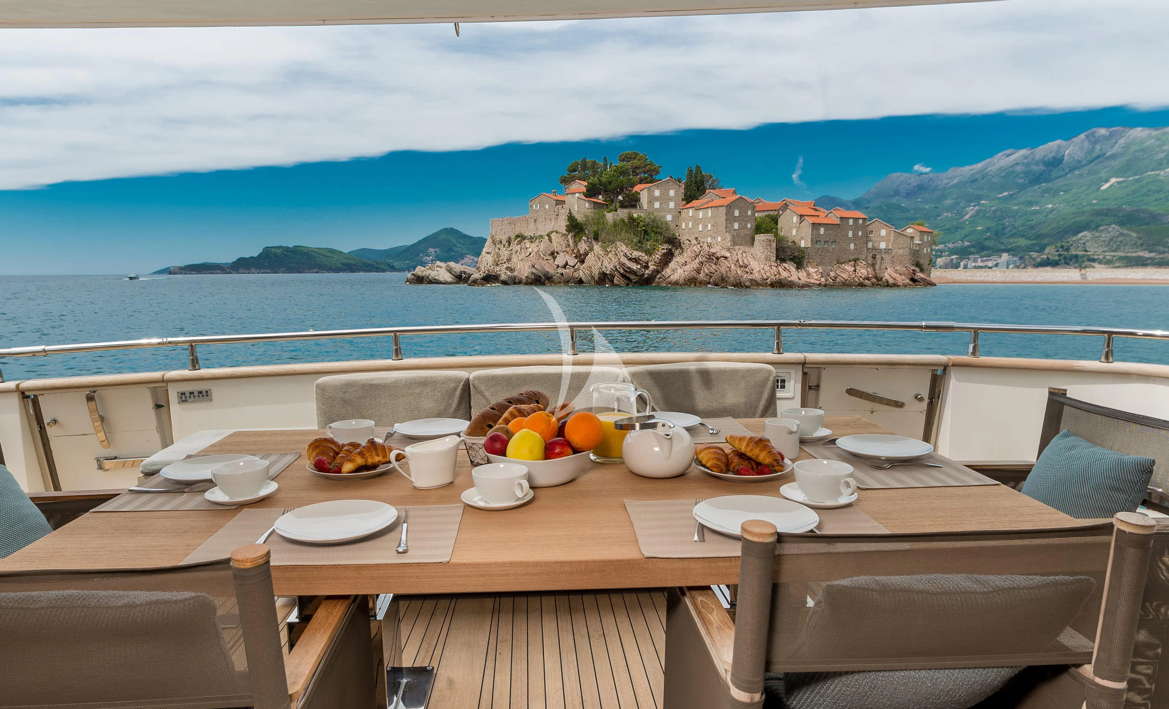 a table with food on it aboard PERTULA Yacht for Sale