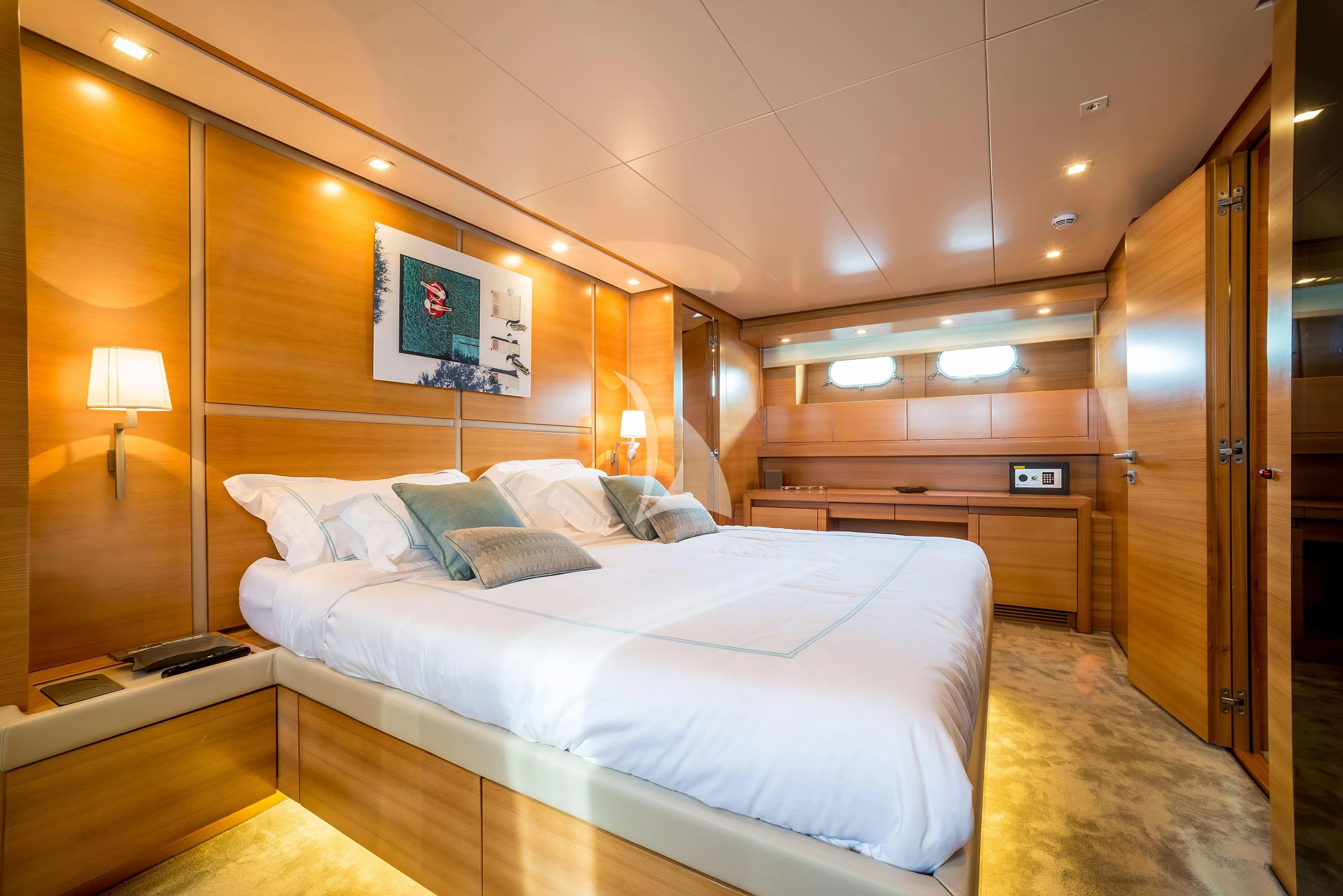 a room with a bed and a desk aboard PERTULA Yacht for Sale