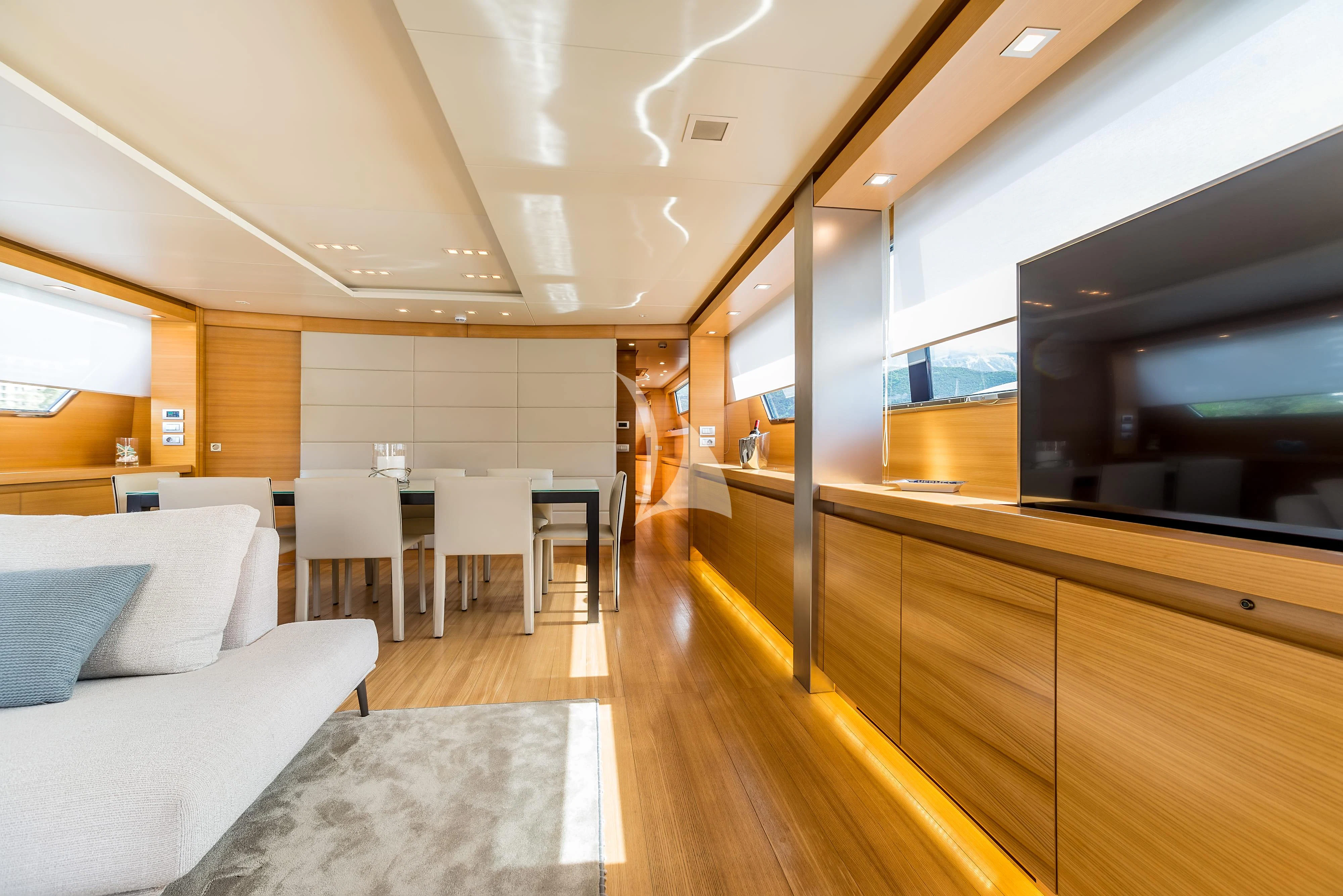 a room with a couch and a tv aboard PERTULA Yacht for Sale