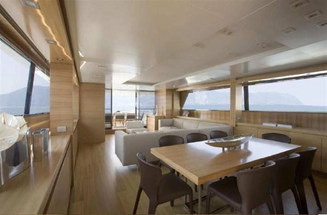 a dining room with a table and chairs aboard PERTULA Yacht for Sale
