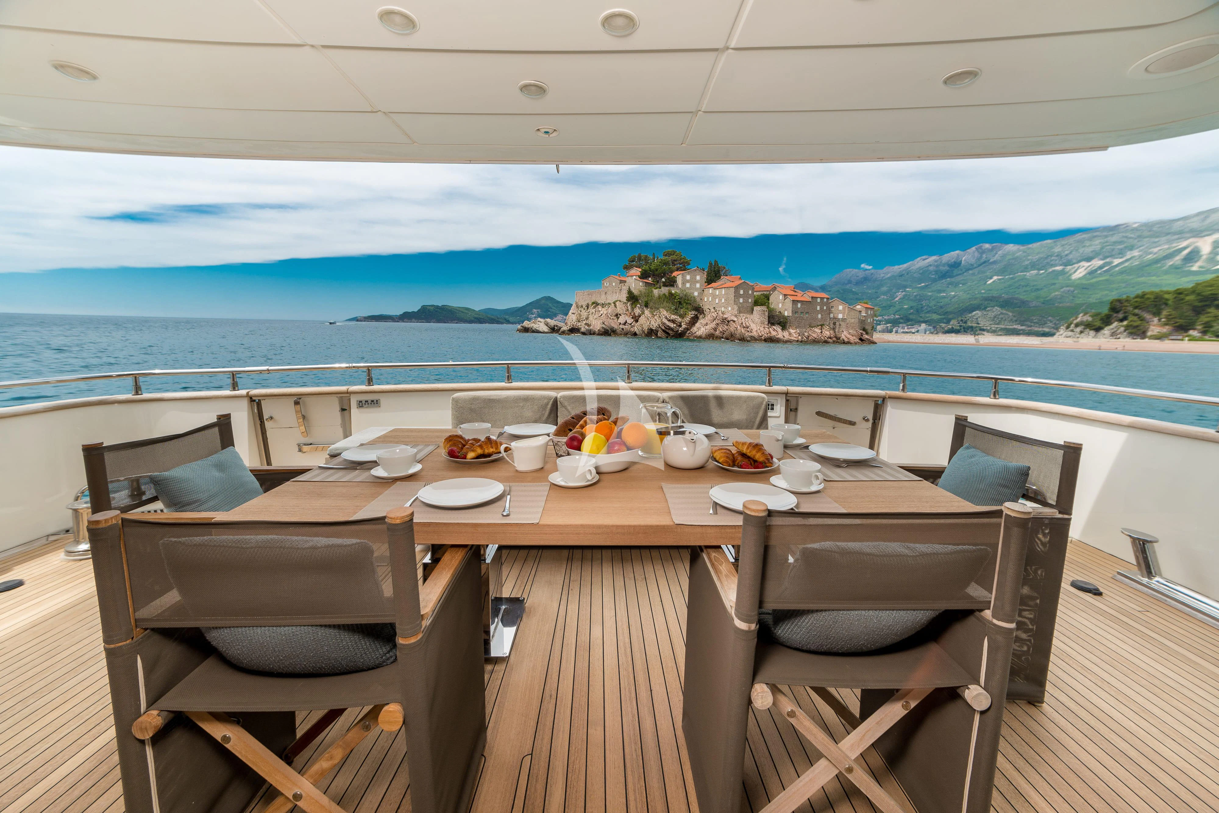 a table with food on it aboard PERTULA Yacht for Sale