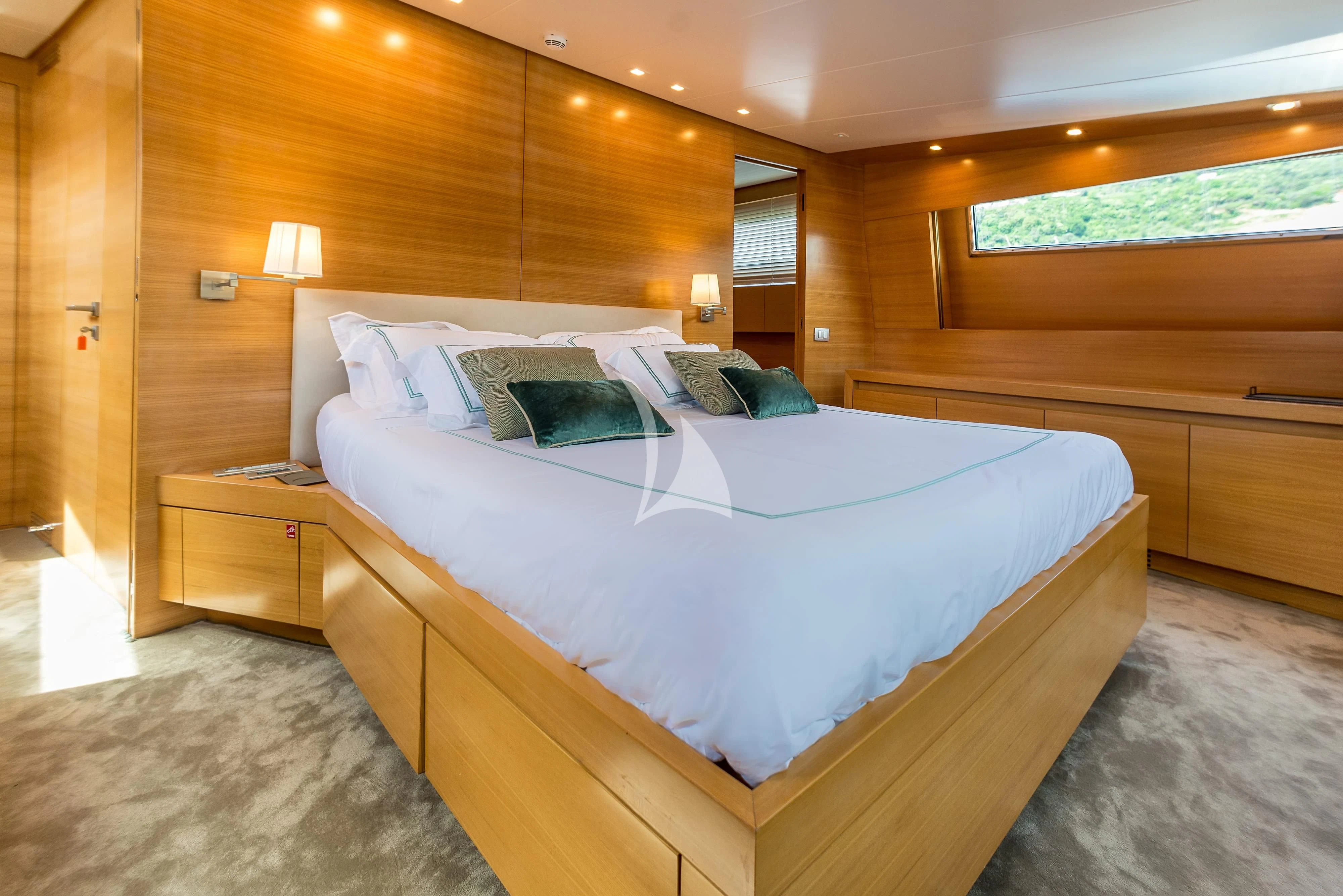 a bed in a room aboard PERTULA Yacht for Sale