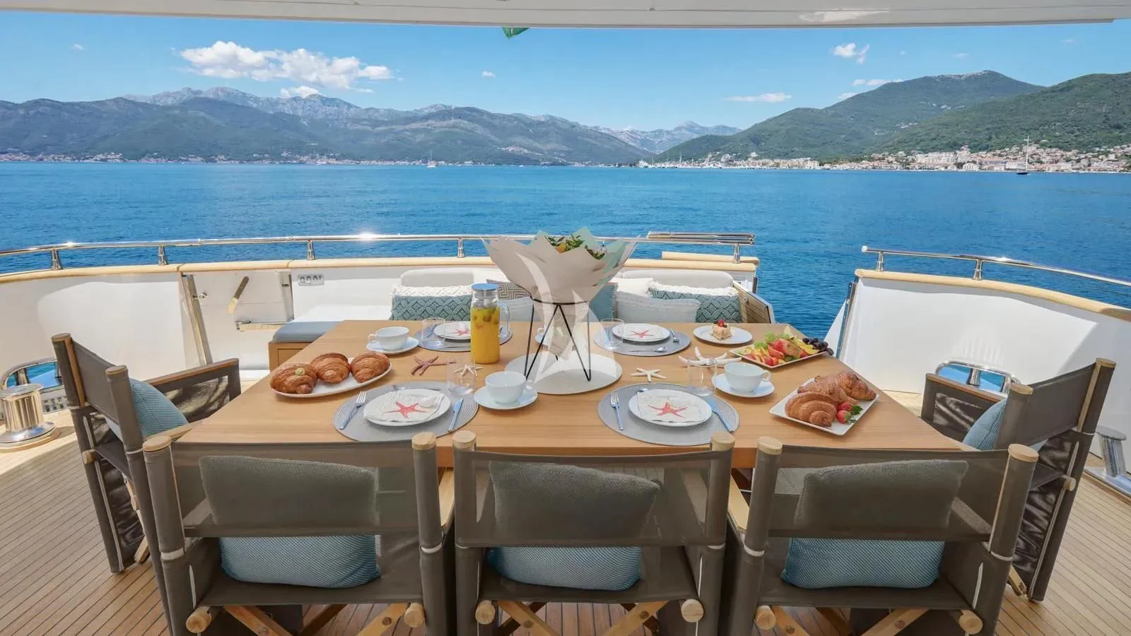 a table with food on it aboard PERTULA Yacht for Sale