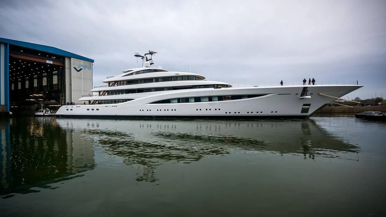 a white yacht docked at a pier aboard SOPHIA Yacht for Sale