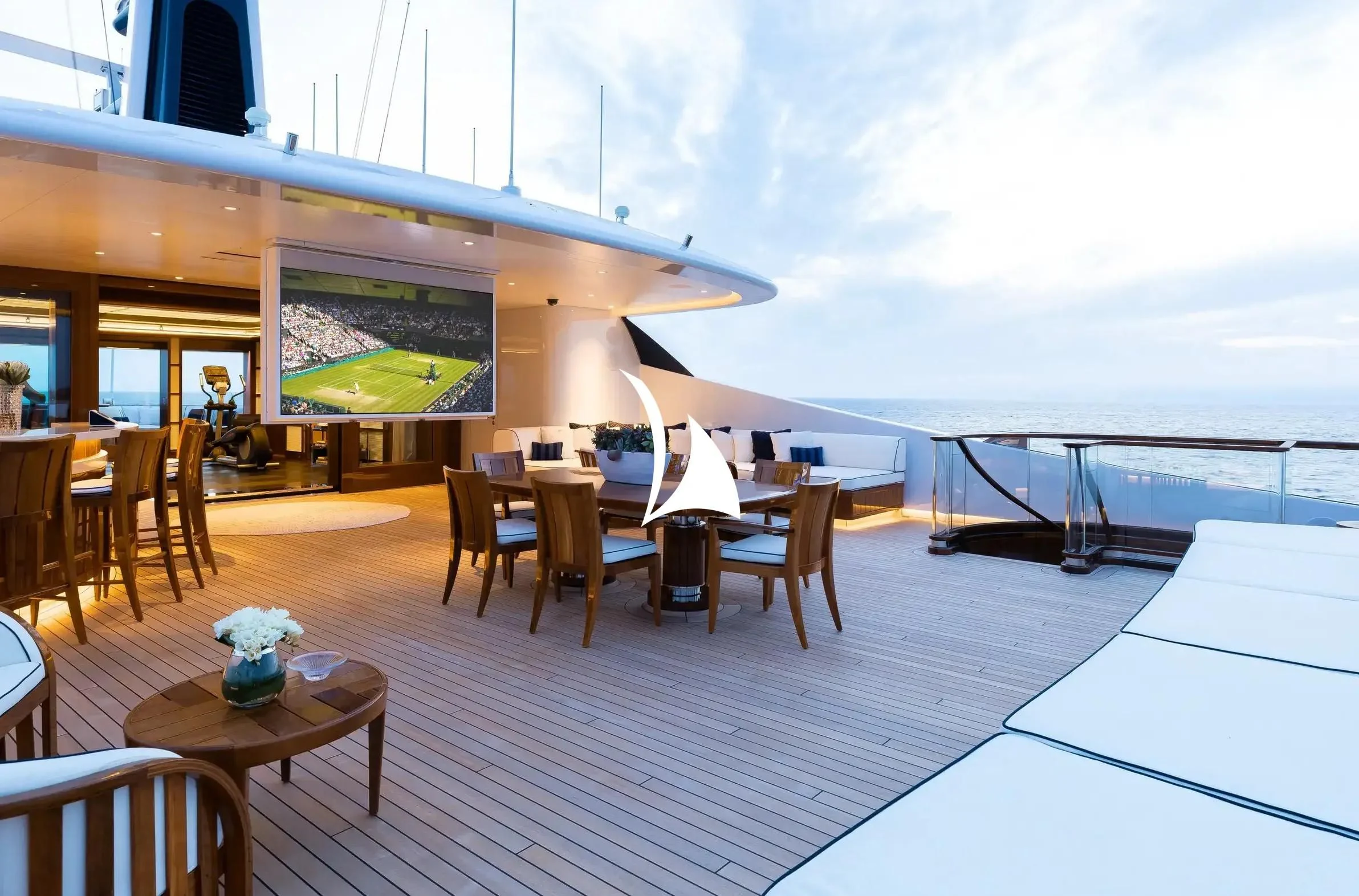 a room with tables and chairs aboard SOPHIA Yacht for Sale
