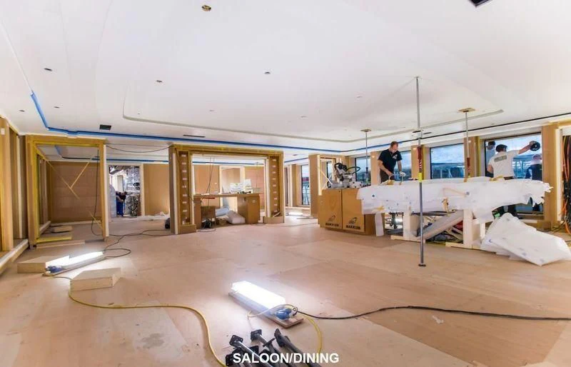 a room with a few people working on a project aboard SOPHIA Yacht for Sale
