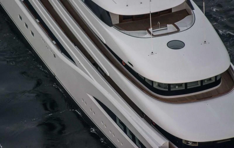 a white car on a road aboard SOPHIA Yacht for Sale
