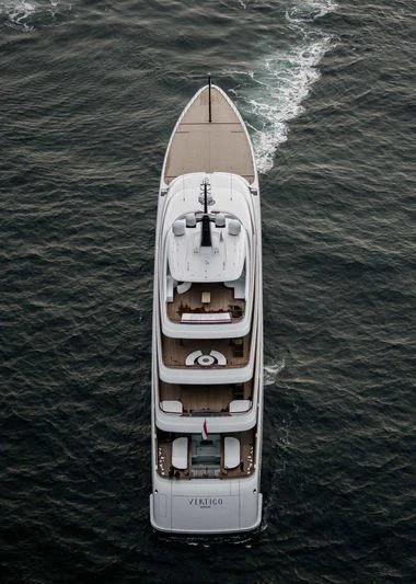 a small white boat in the water aboard SOPHIA Yacht for Sale