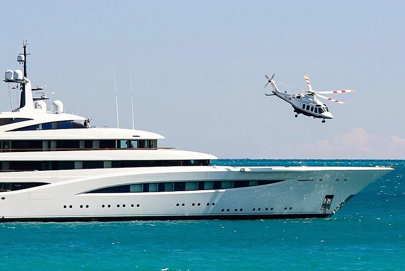 a helicopter flying over a boat aboard SOPHIA Yacht for Sale