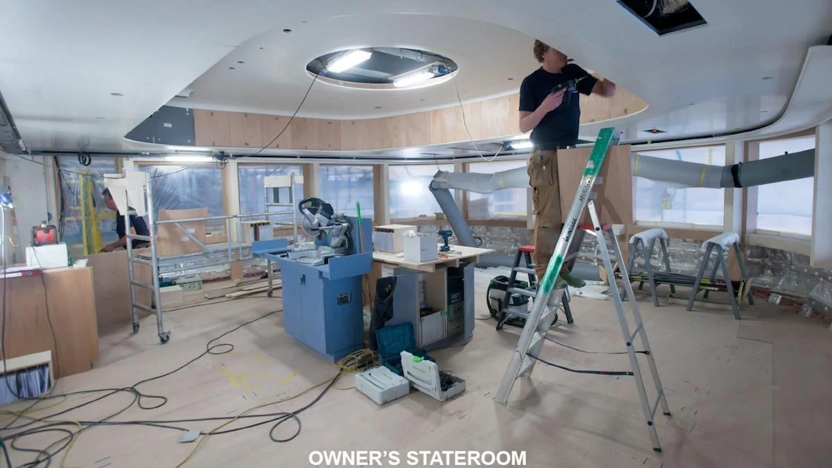 a person working on a project aboard SOPHIA Yacht for Sale