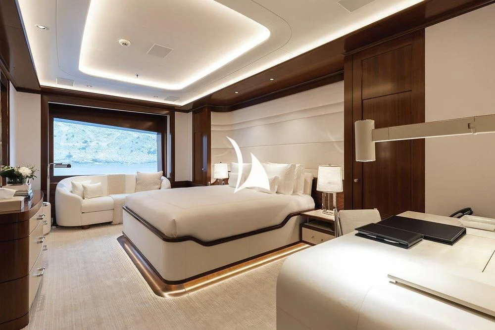 a room with a bed and a desk aboard SOPHIA Yacht for Sale