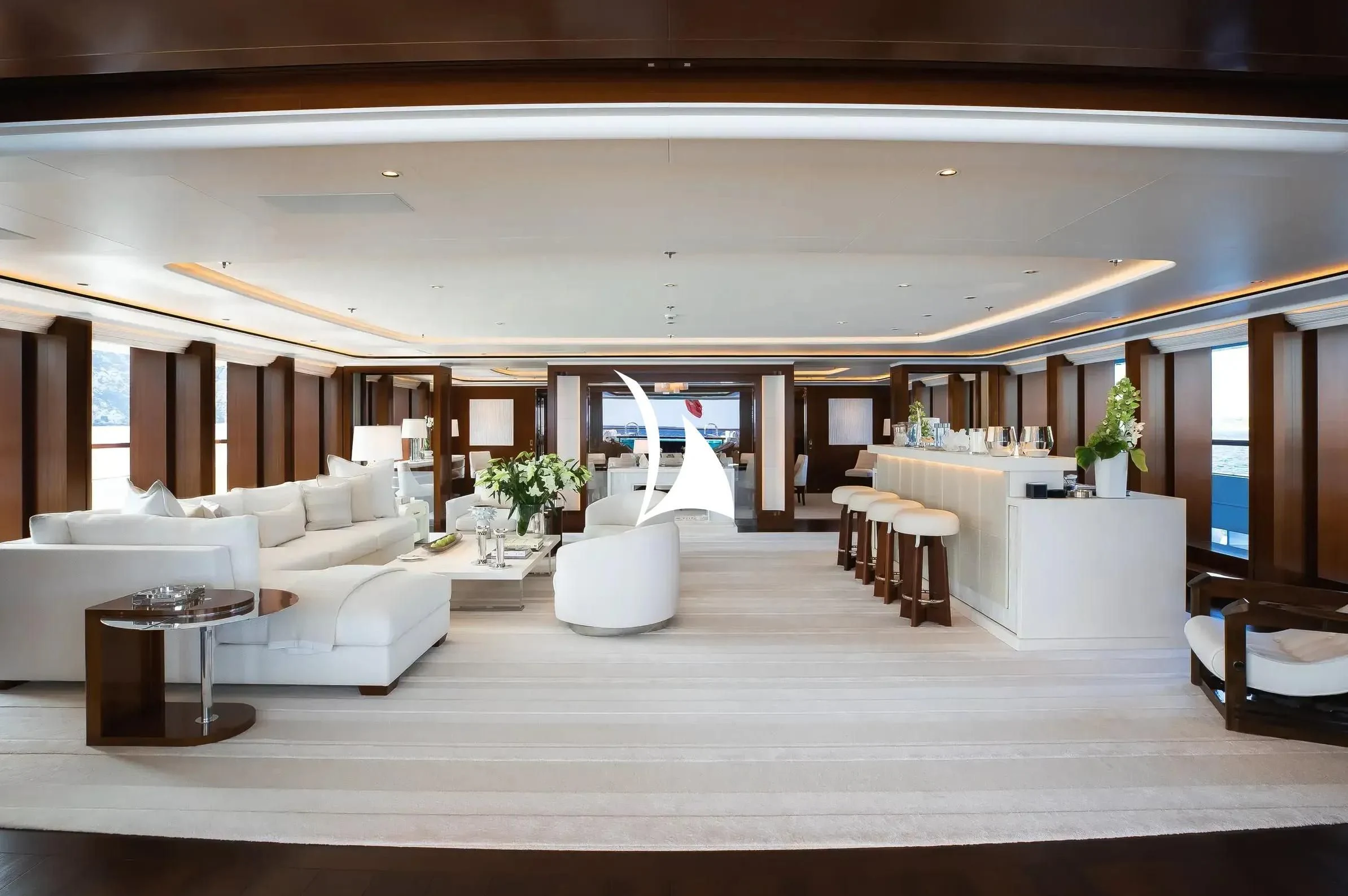 a room with white couches and a table aboard SOPHIA Yacht for Sale