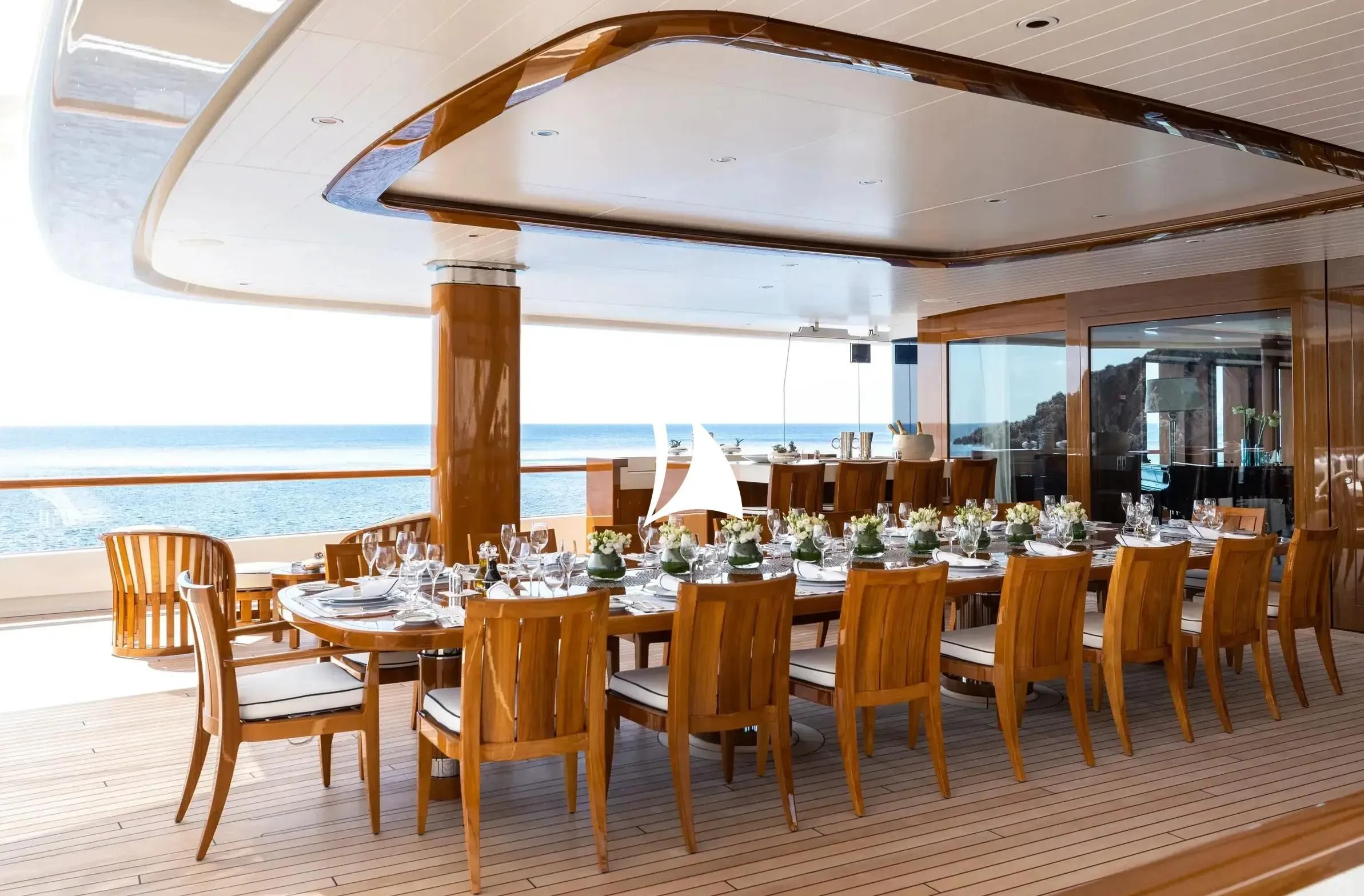 a large dining table with chairs aboard SOPHIA Yacht for Sale