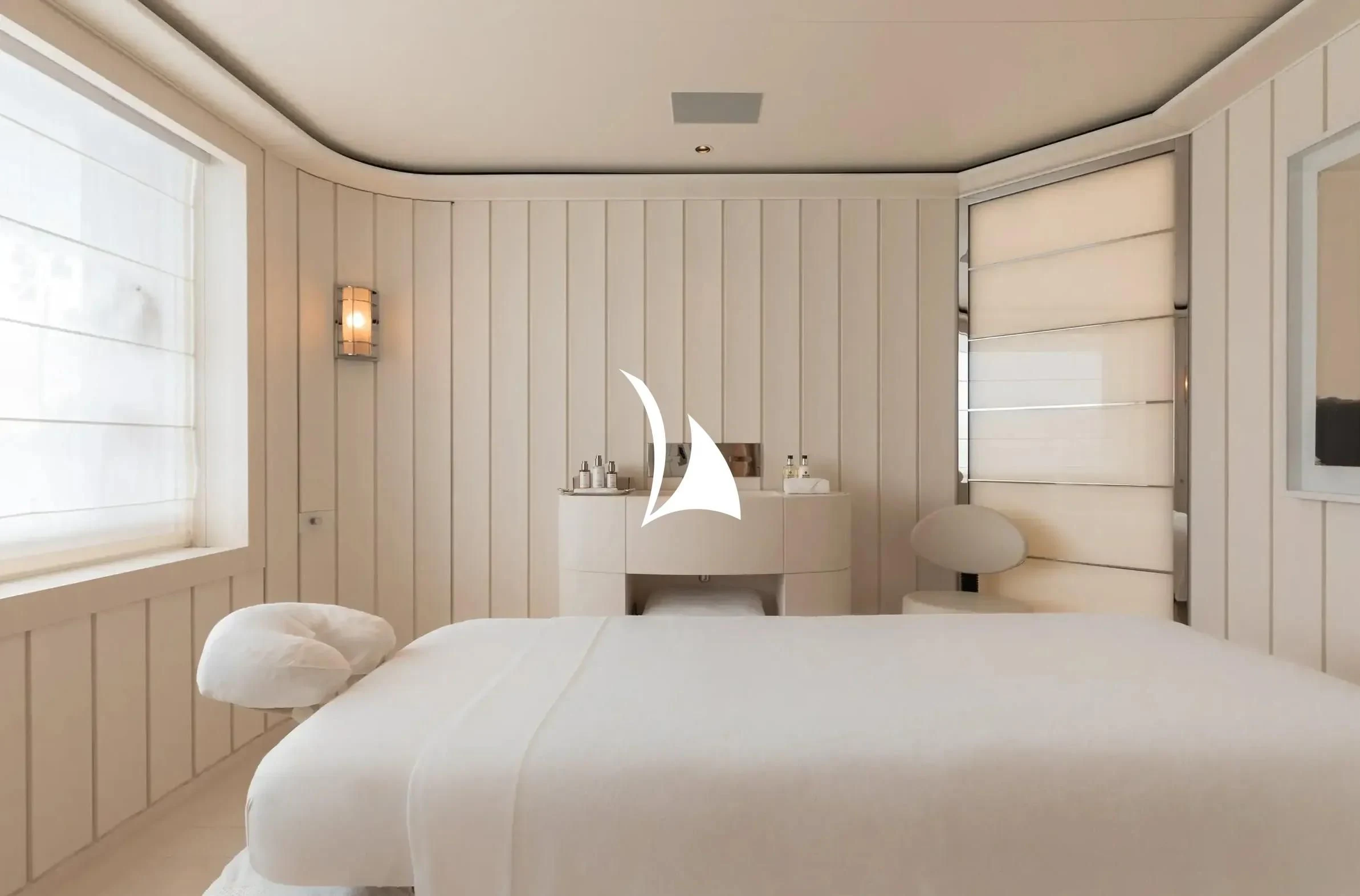 a white bedroom with a white bed aboard SOPHIA Yacht for Sale