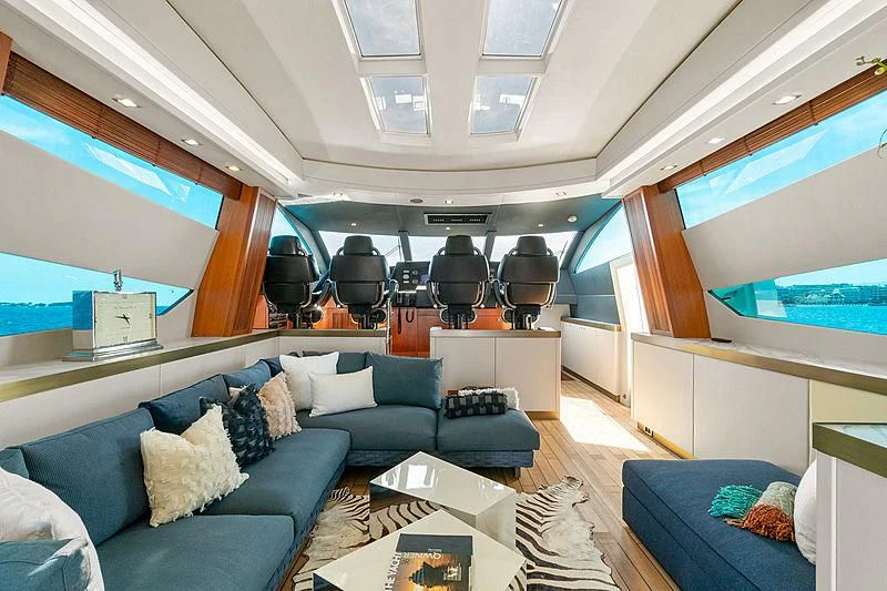 a room with a couch and a television aboard EYE Yacht for Sale