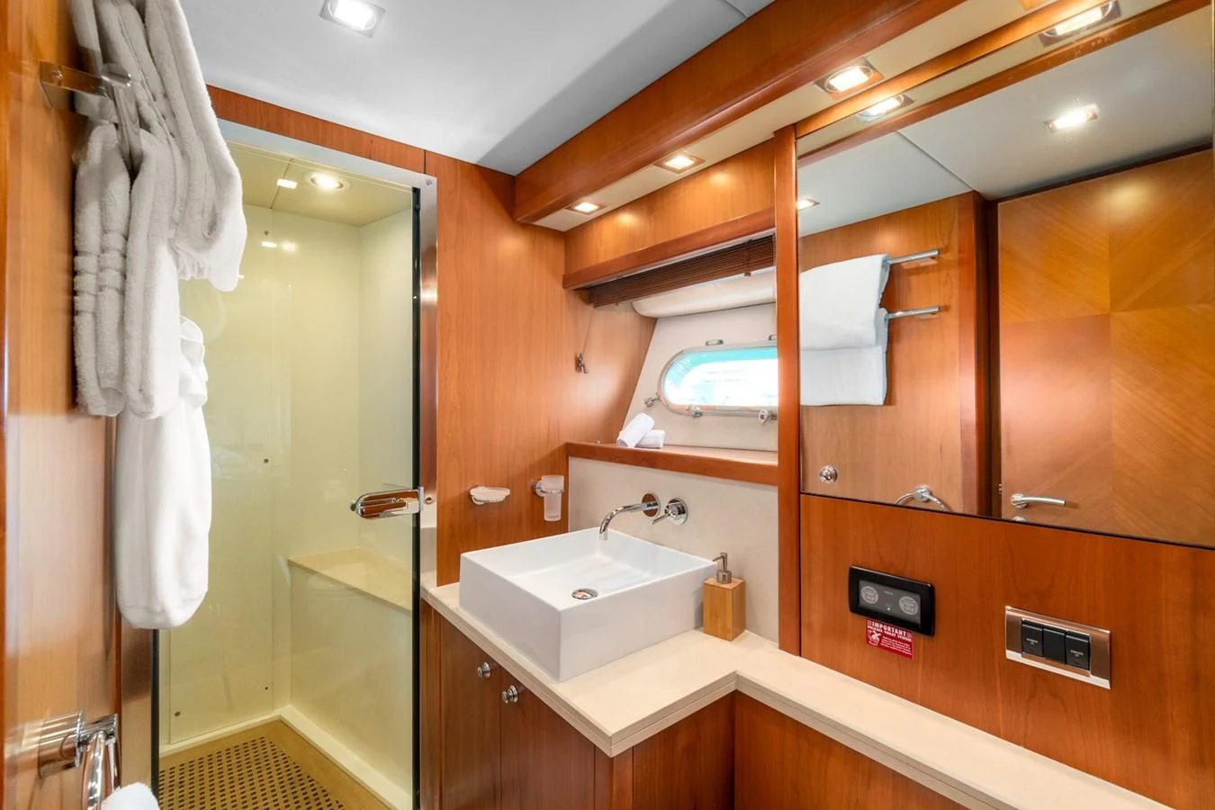 a bathroom with a sink and a mirror aboard EYE Yacht for Sale