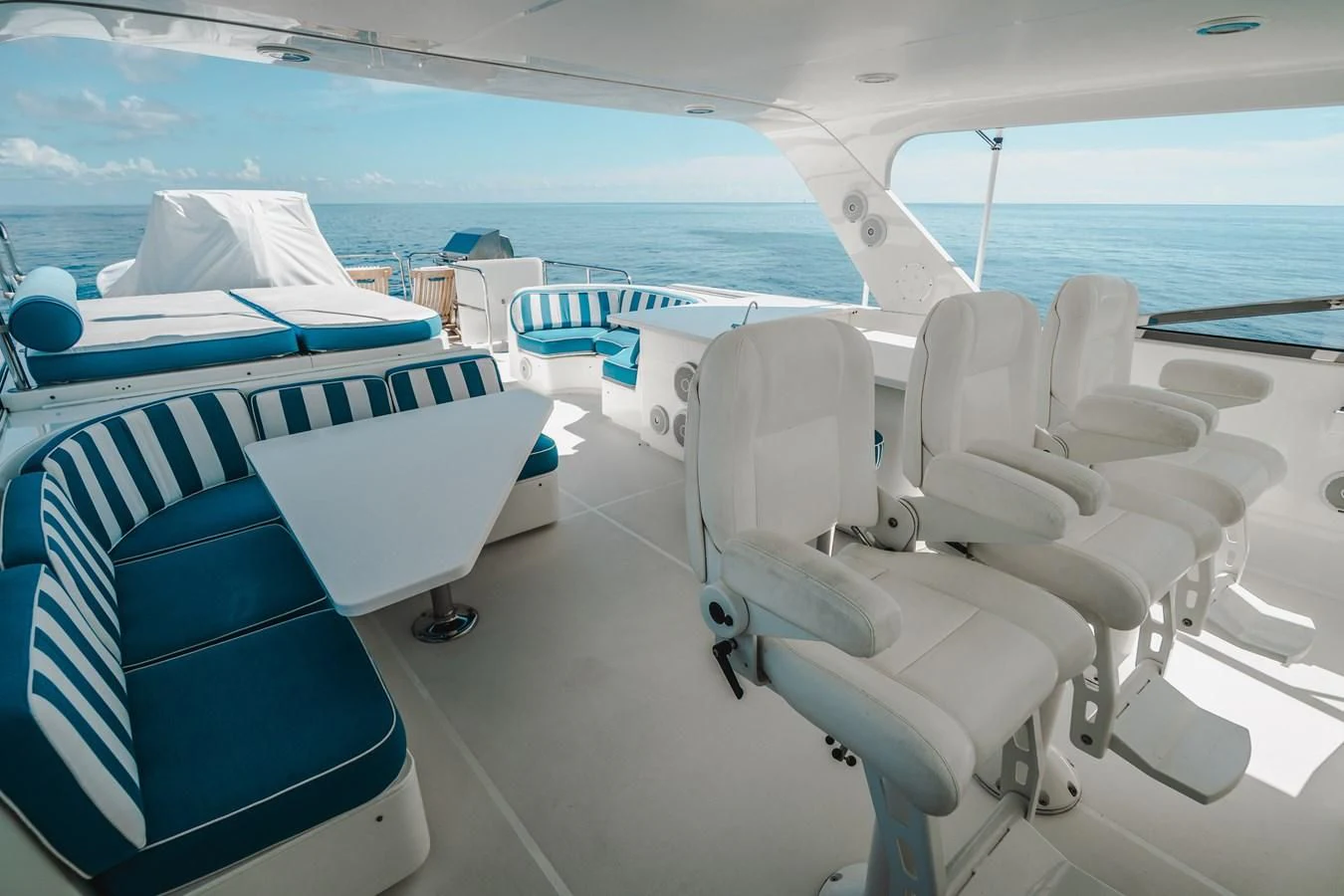 a group of chairs on a boat aboard L'DOR V'DOR Yacht for Sale