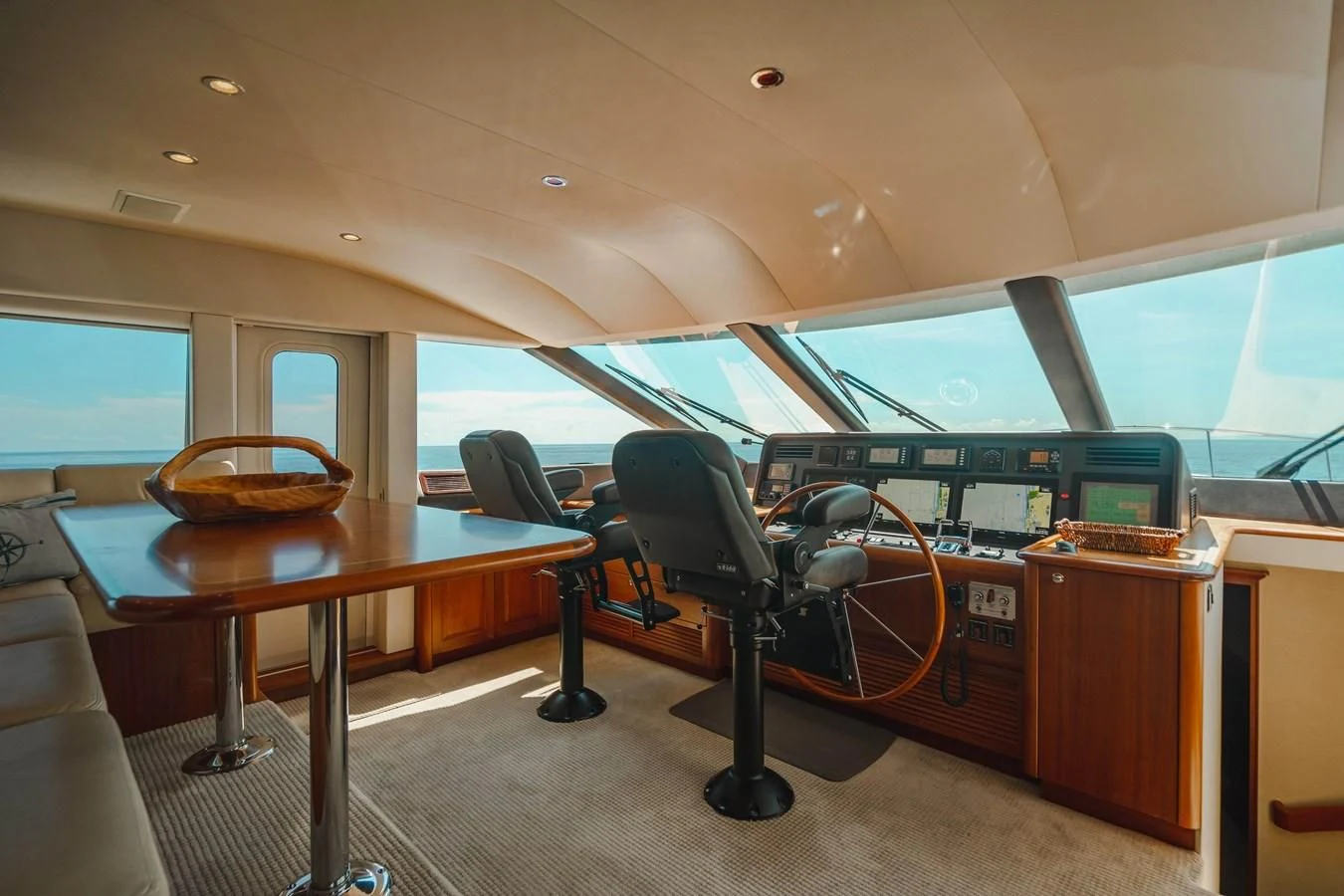 a room with a table and chairs aboard L'DOR V'DOR Yacht for Sale