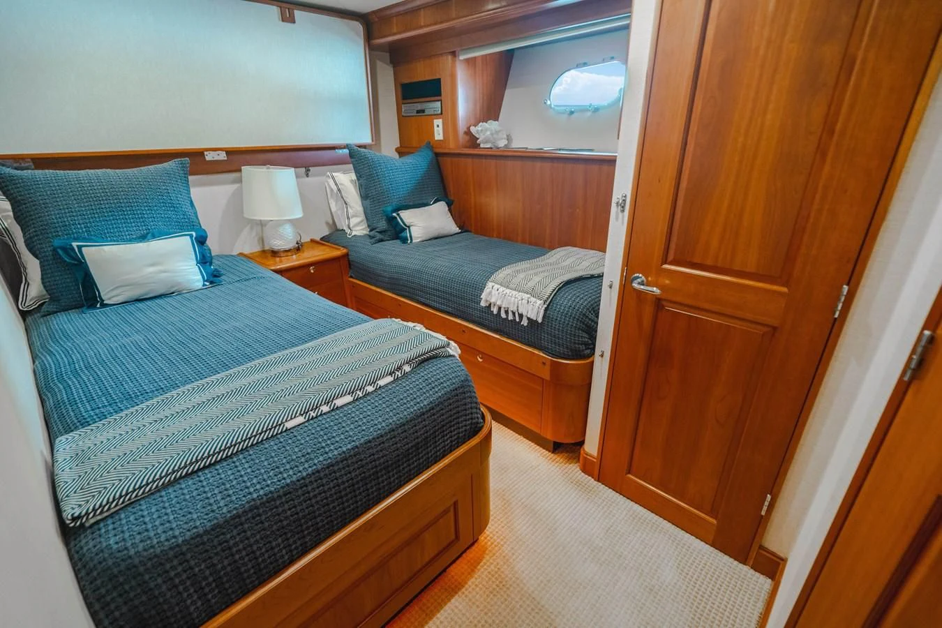 a couple of beds in a hotel room aboard L'DOR V'DOR Yacht for Sale