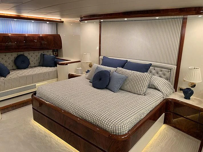 a bedroom with two beds aboard SASHAY Yacht for Sale