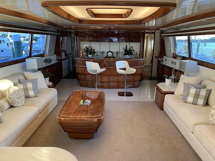 a living room with a large window aboard SASHAY Yacht for Sale