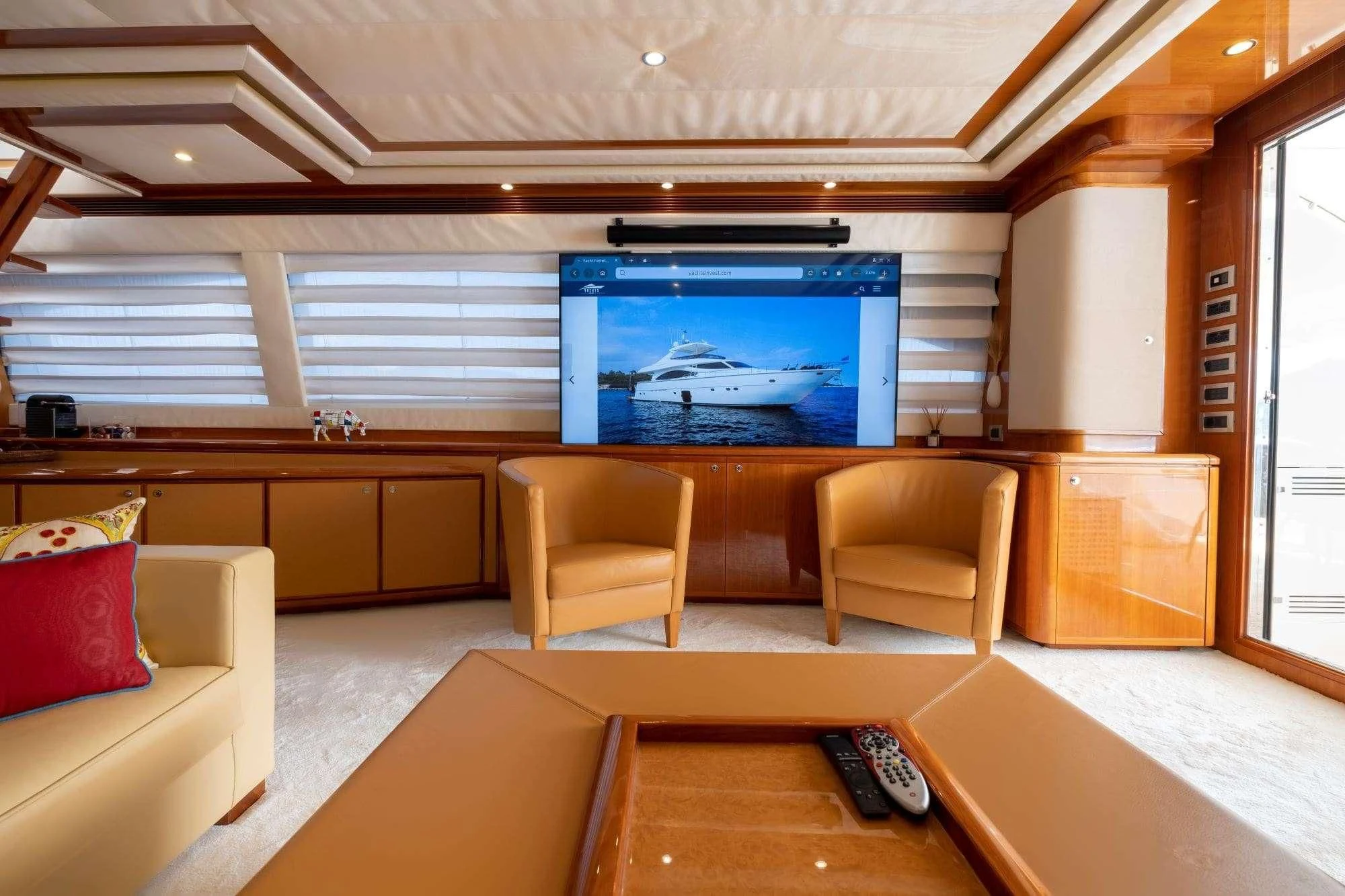 a room with a tv and chairs aboard ASTARTE Yacht for Sale