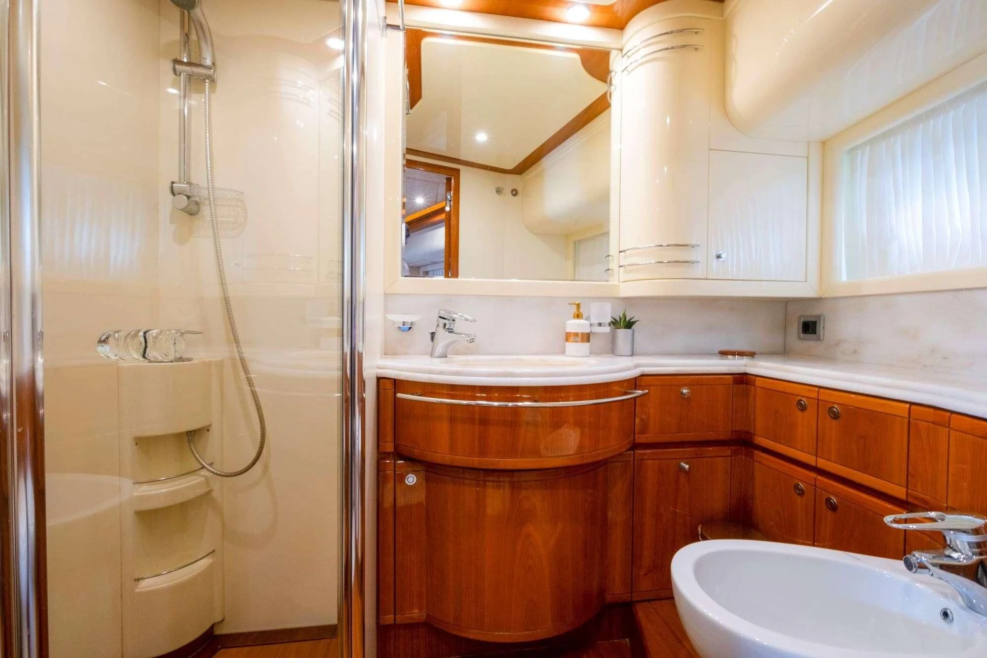 a bathroom with a shower sink and a mirror aboard ASTARTE Yacht for Sale