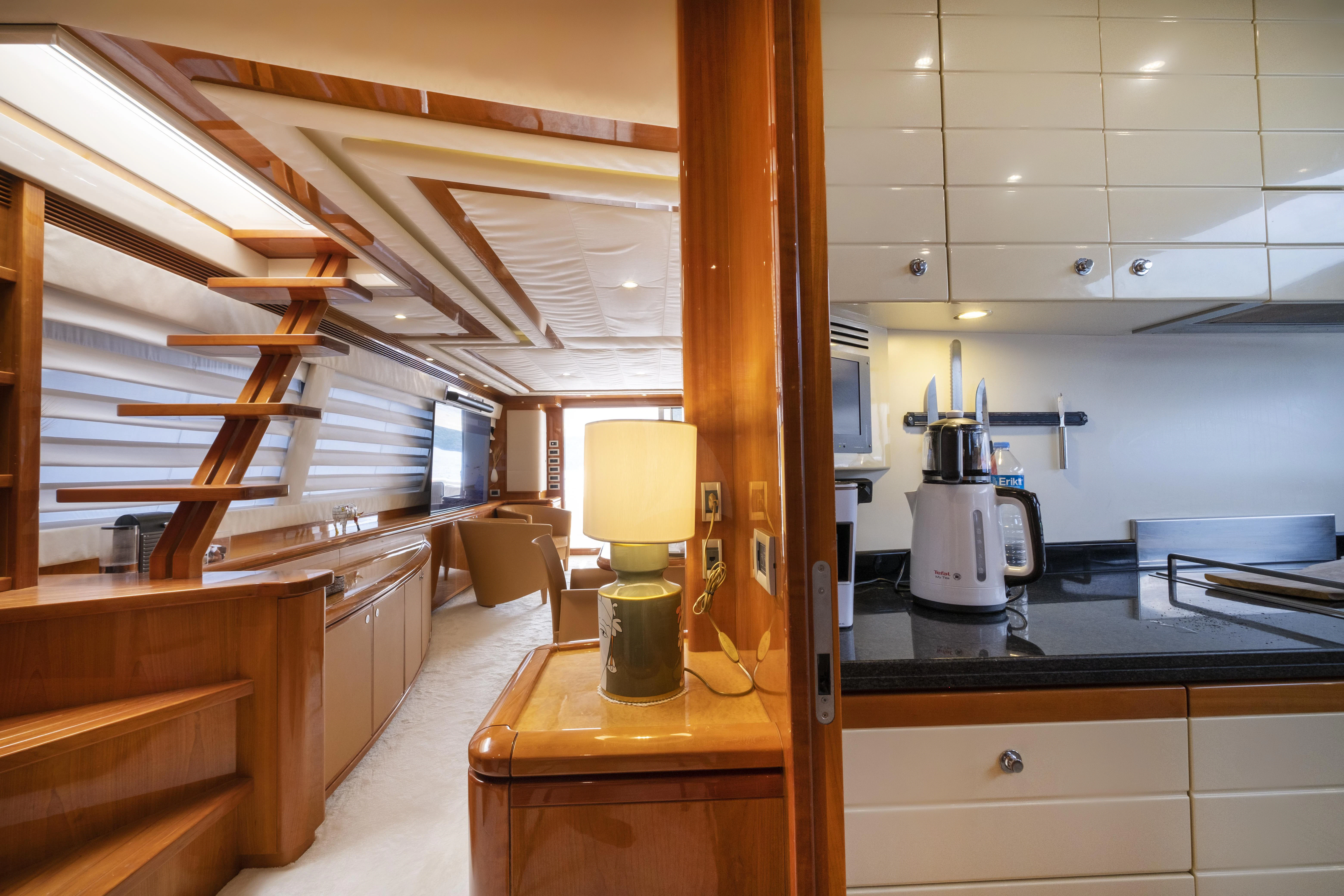 a kitchen with a table and a lamp aboard ASTARTE Yacht for Sale