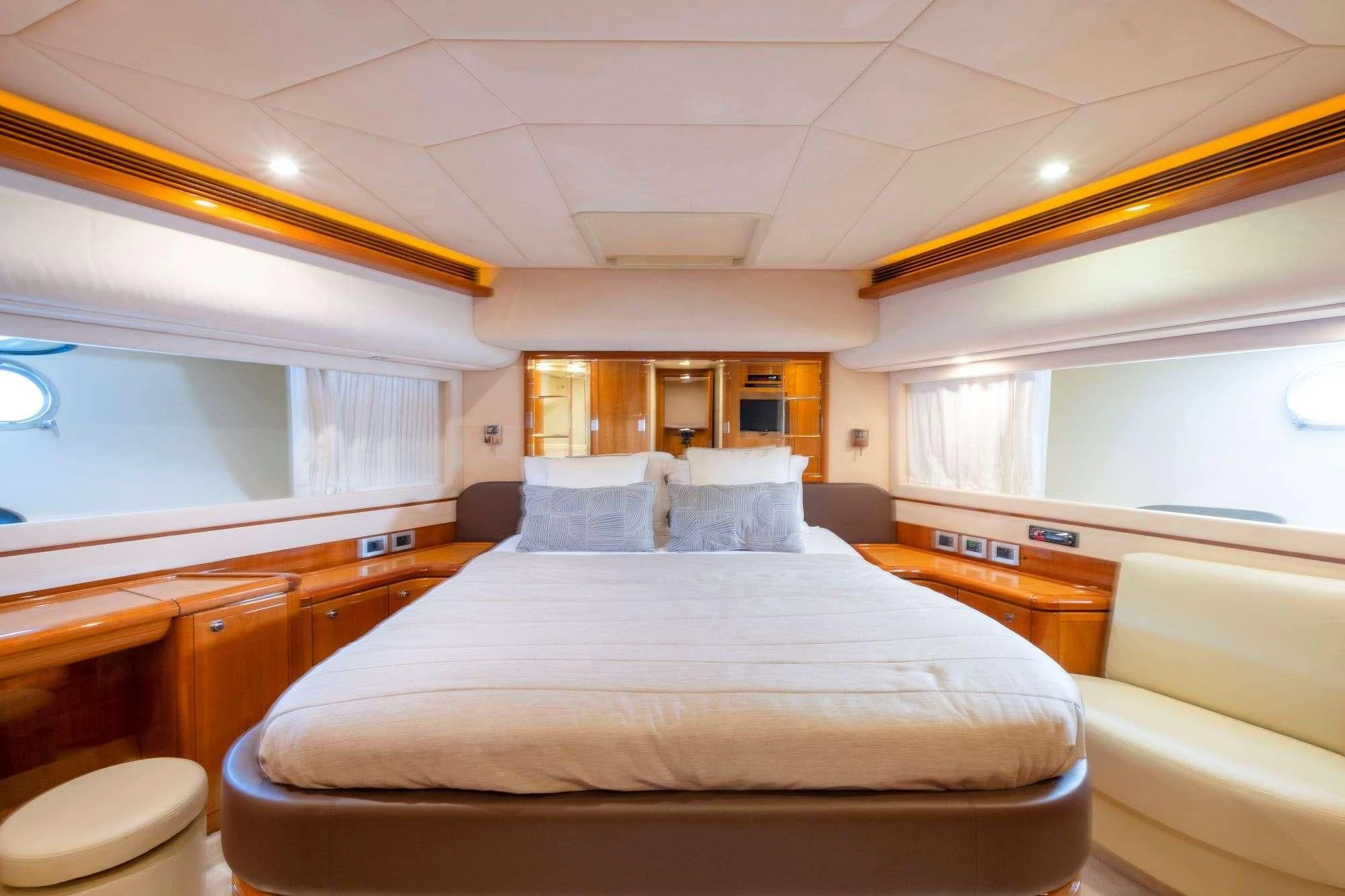 a bedroom with a bed and a desk aboard ASTARTE Yacht for Sale