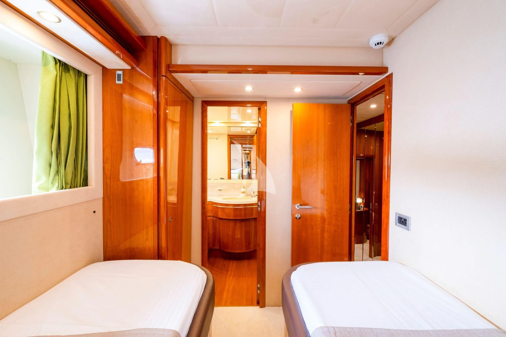 a bedroom with a bed and a mirror aboard ASTARTE Yacht for Sale
