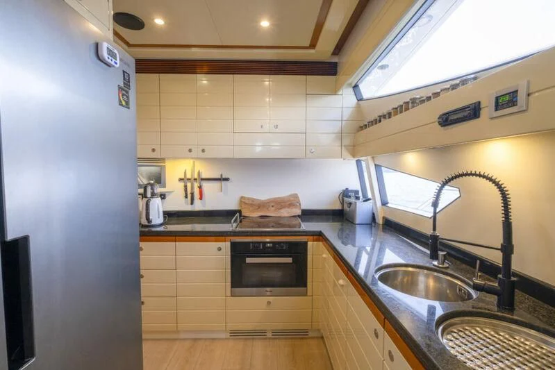 a kitchen with a sink and stove aboard ASTARTE Yacht for Sale