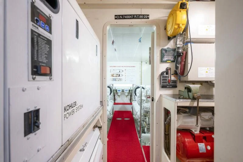 a room with white doors and red carpet aboard ASTARTE Yacht for Sale