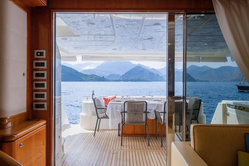 a room with a table and chairs aboard ASTARTE Yacht for Sale