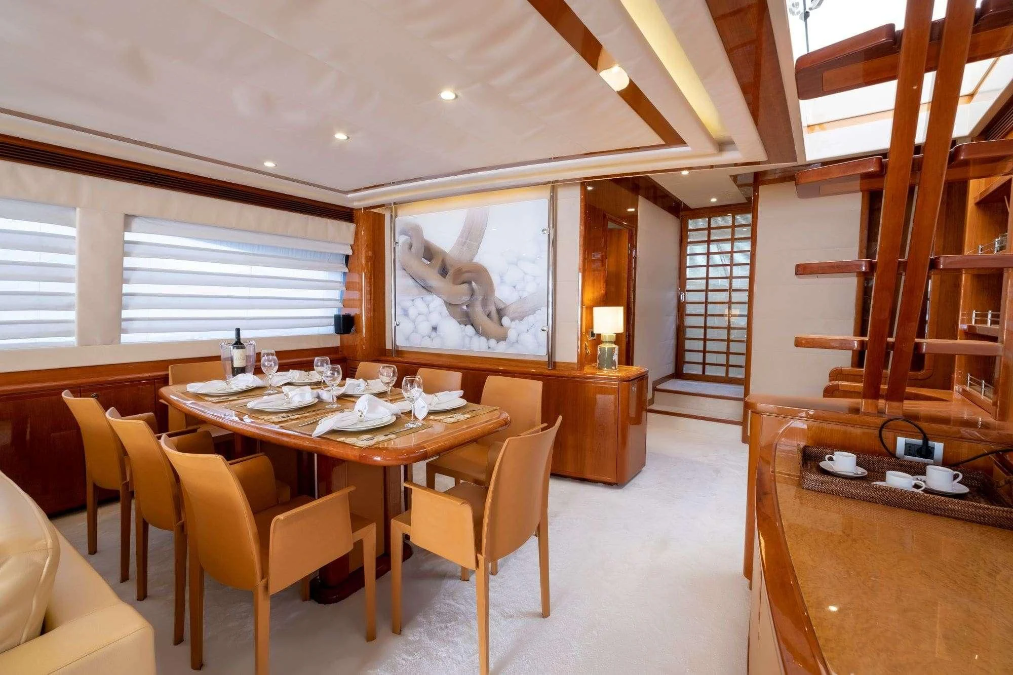 a room with a table and chairs aboard ASTARTE Yacht for Sale