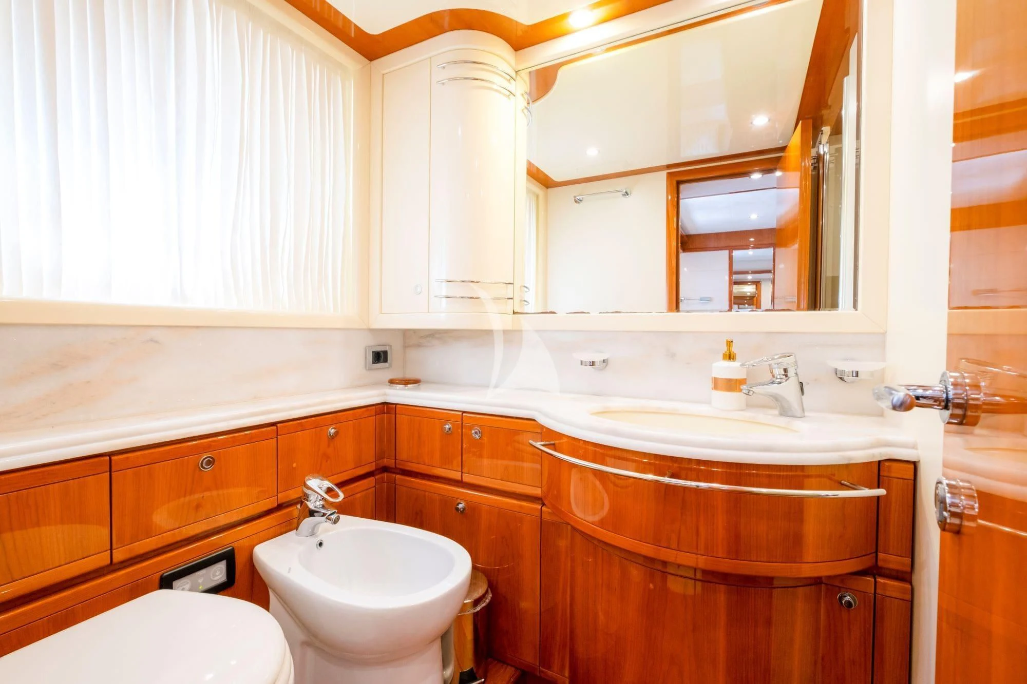 a bathroom with a sink and a mirror aboard ASTARTE Yacht for Sale