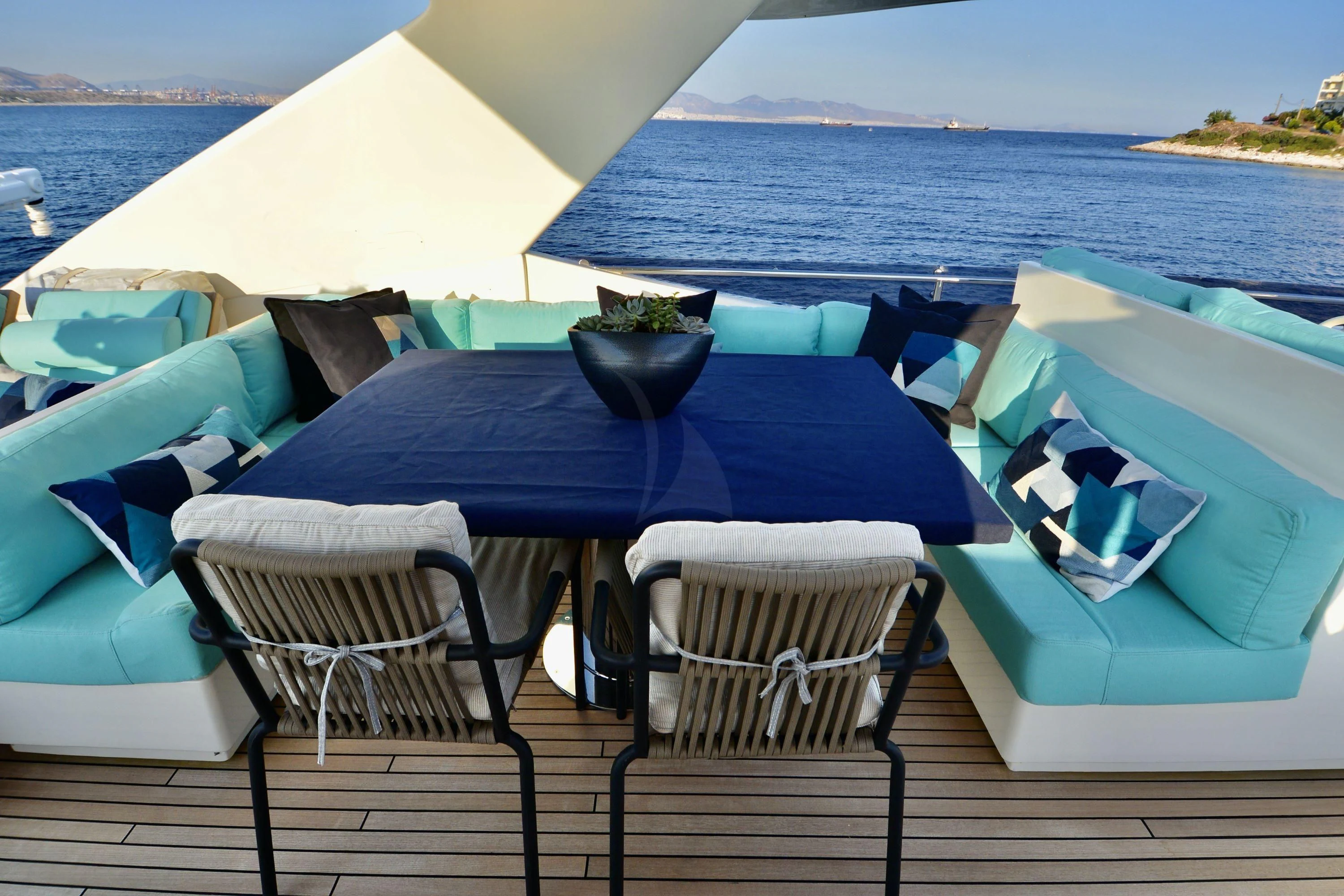 a table and chairs on a deck aboard ASTARTE Yacht for Sale