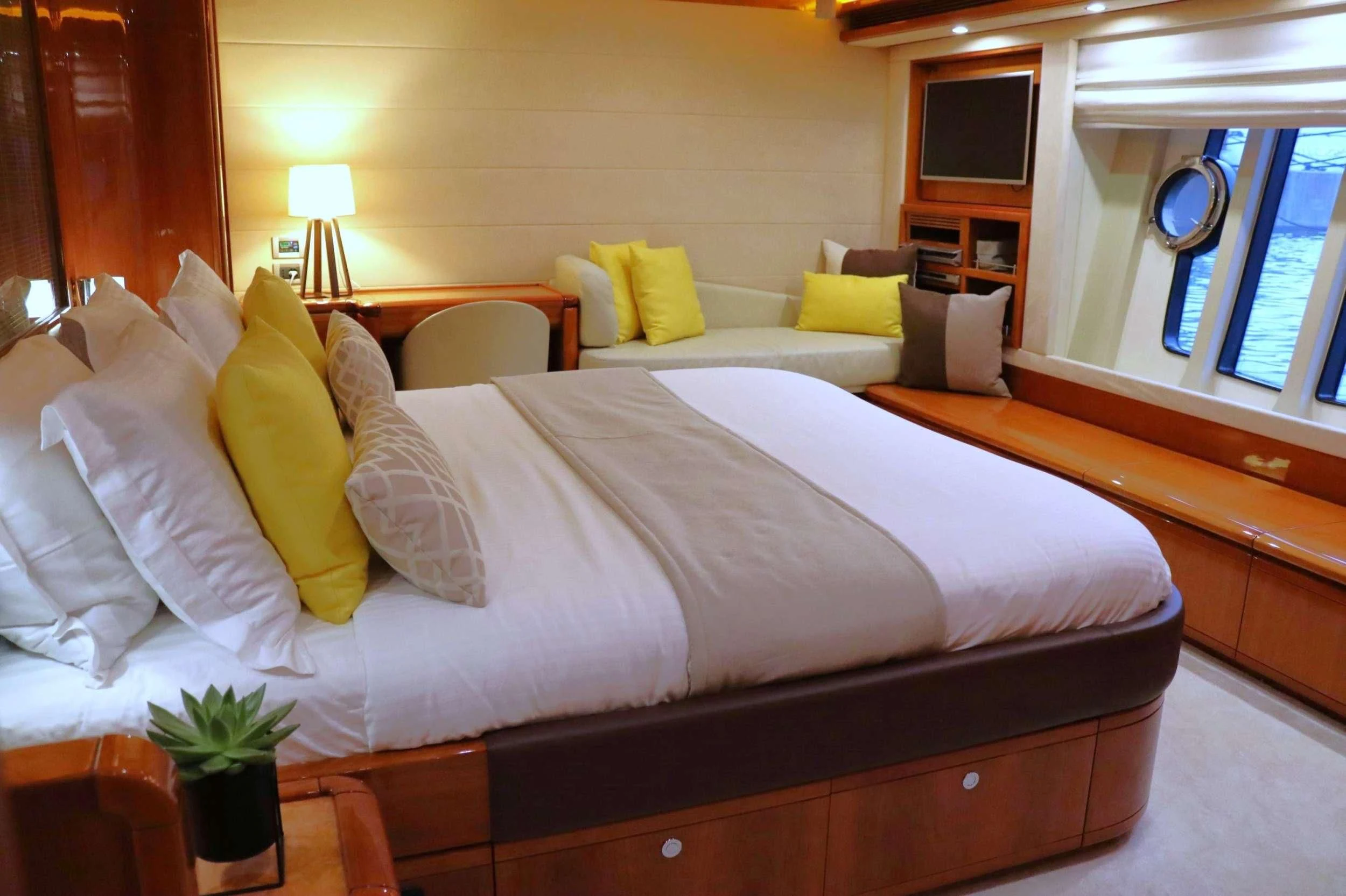 a bed with white sheets and pillows aboard ASTARTE Yacht for Sale
