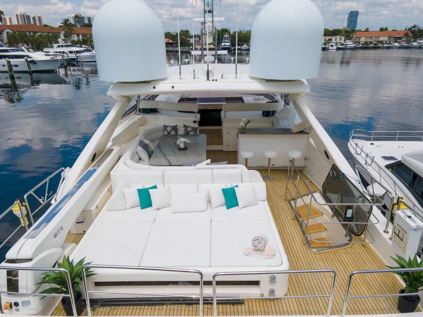 a large white ship docked aboard ADAR Yacht for Sale