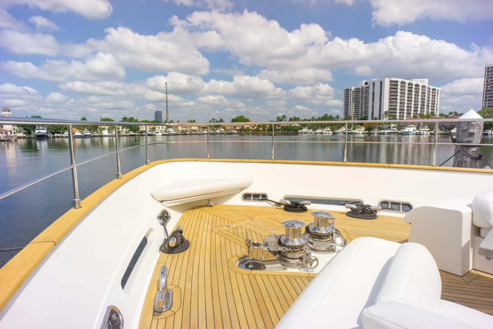 a deck with a table and chairs on it aboard ADAR Yacht for Sale