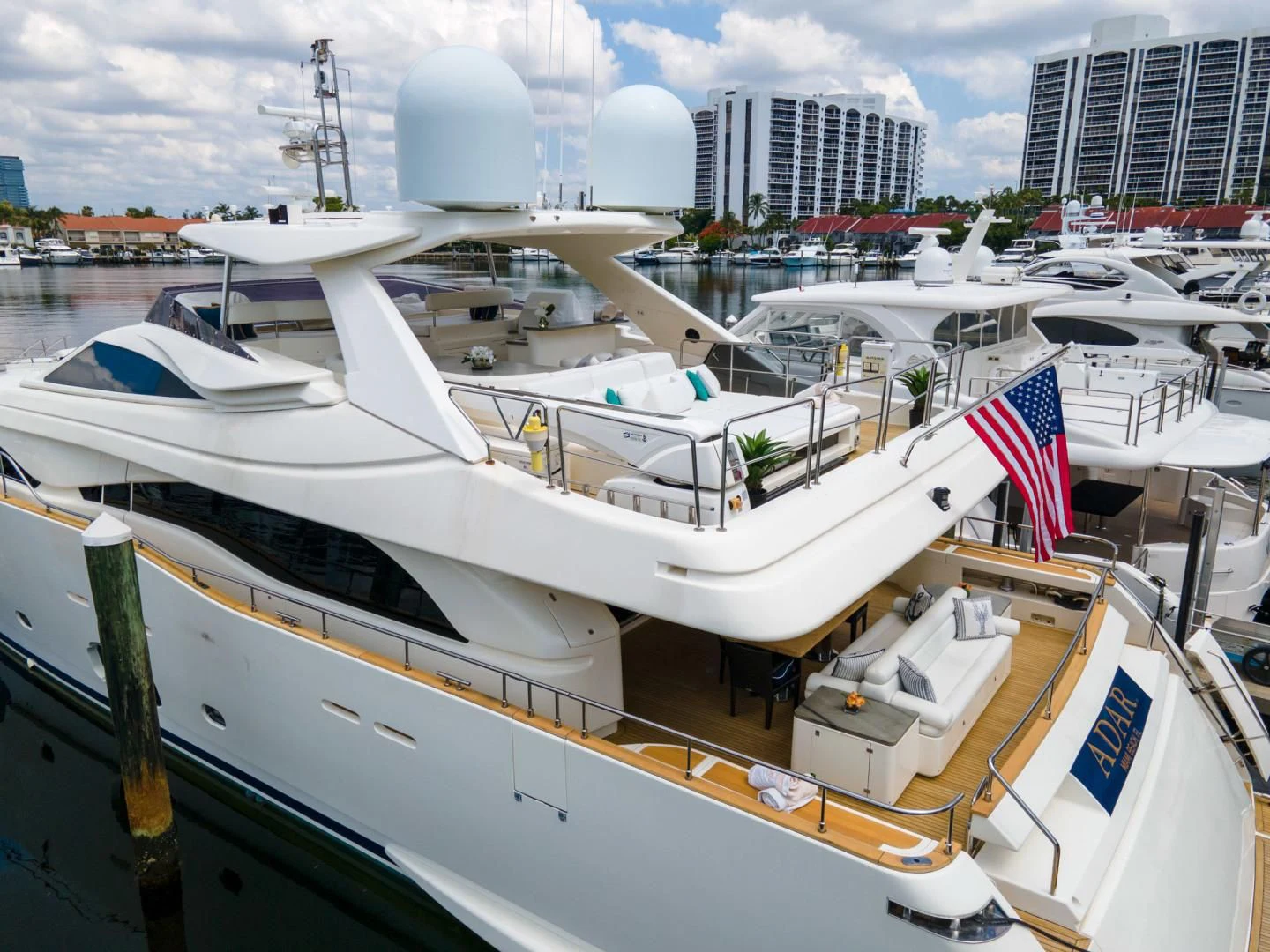 a boat docked at a pier aboard ADAR Yacht for Sale