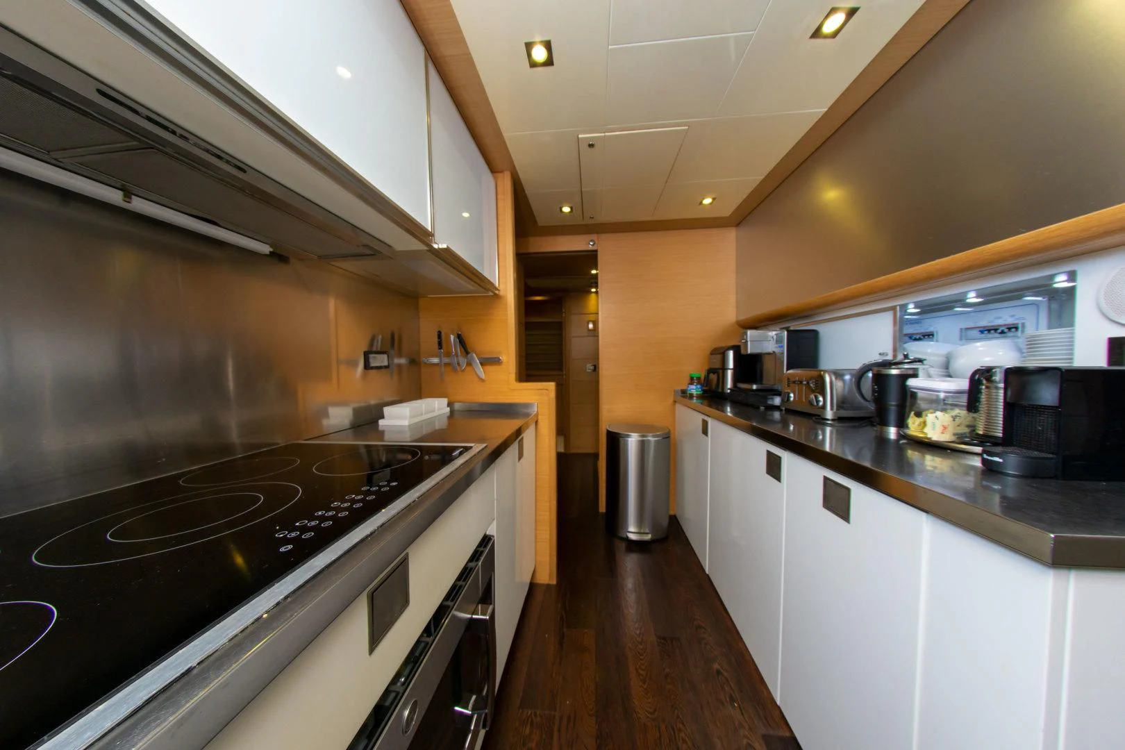 a kitchen with stainless steel appliances aboard ADAR Yacht for Sale