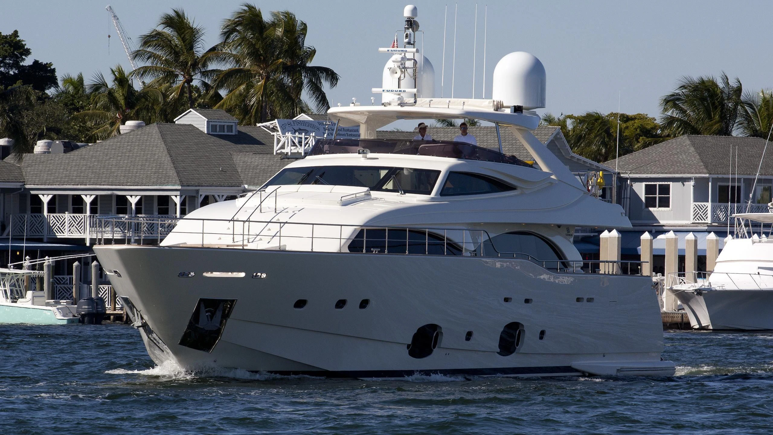 a white yacht in the water aboard ADAR Yacht for Sale