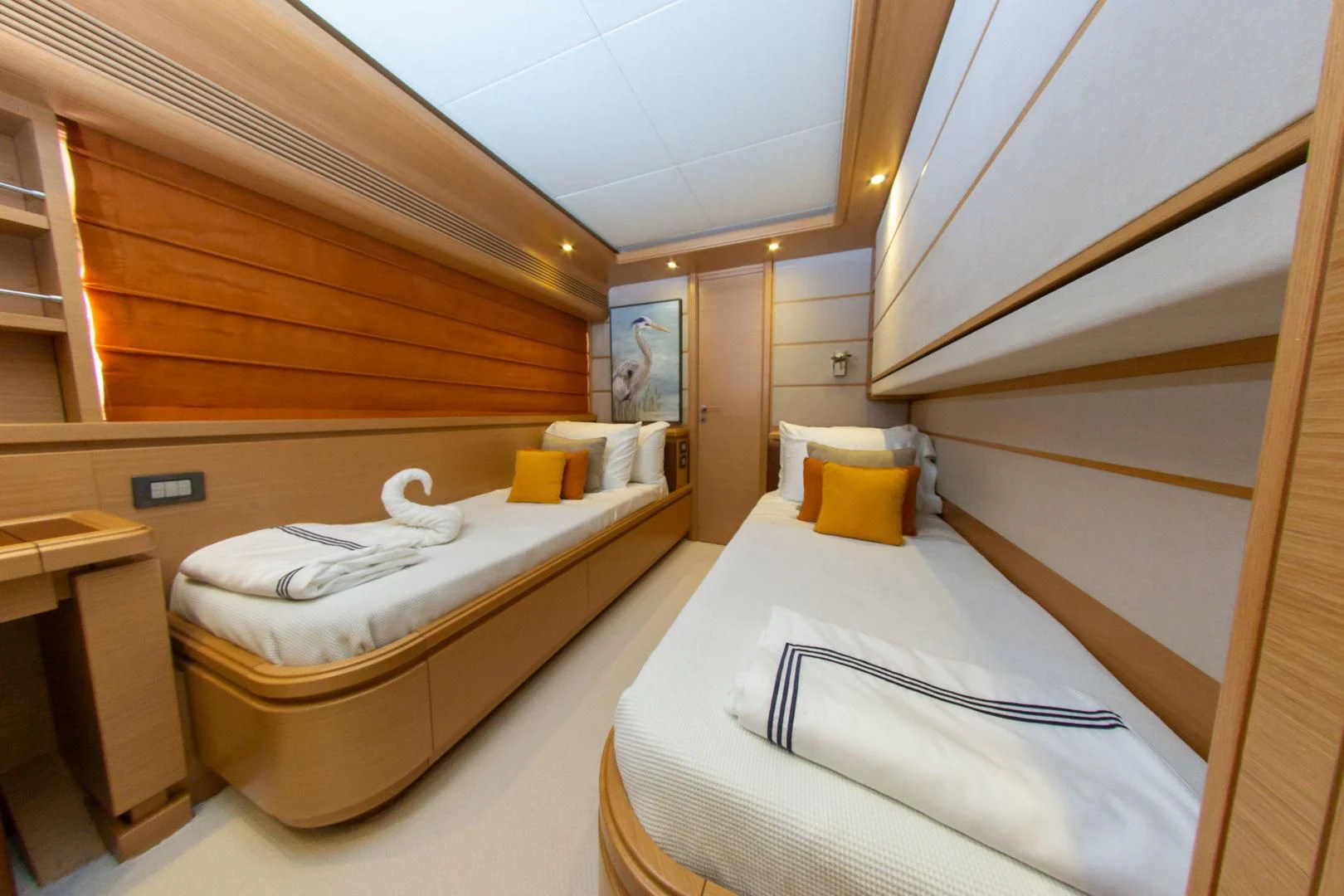 a room with two beds aboard ADAR Yacht for Sale