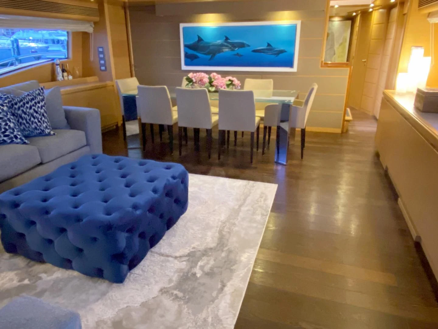 a room with tables and chairs aboard ADAR Yacht for Sale