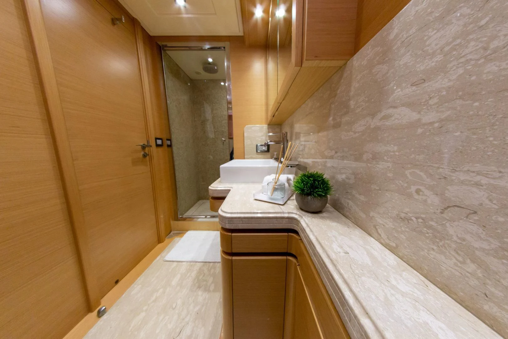 a bathroom with a marble counter top aboard ADAR Yacht for Sale