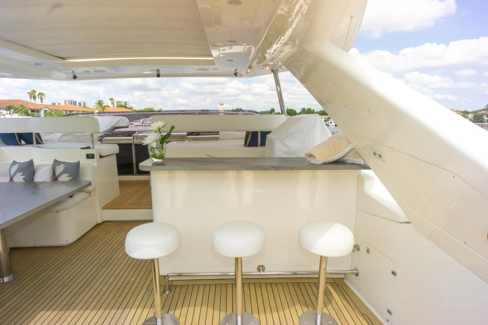 a room with a bed and stools aboard ADAR Yacht for Sale