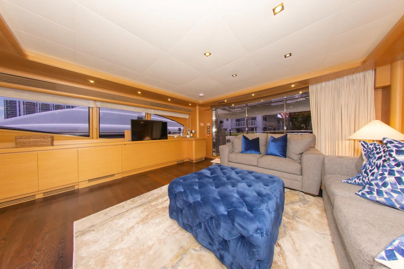 a living room with a couch and a tv aboard ADAR Yacht for Sale