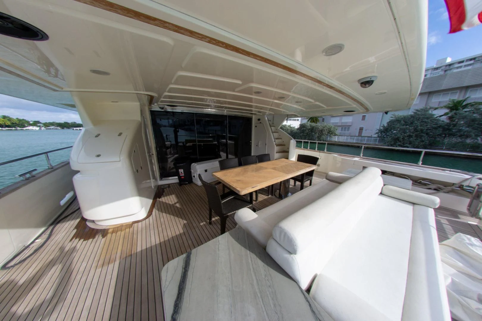 a room with a table and chairs aboard ADAR Yacht for Sale