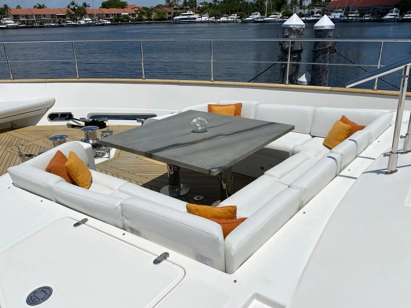 a white boat on a deck aboard ADAR Yacht for Sale
